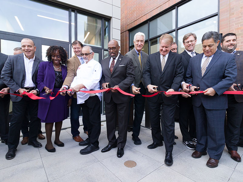 The event’s speakers and key players gathered to participate in the new center’s official ribbon-cutting. 