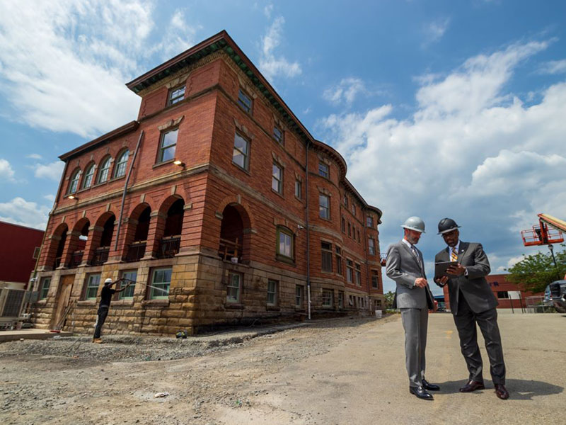 CCAC President Dr. Quintin Bullock and Interim Chief Academic Officer Dr. Stephen Wells survey the ongoing renovation work that’s transforming Chalfant Hall into the new Center for Teaching & Learning. 