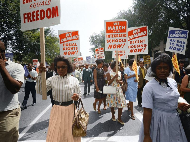 Protestors march in a historic photograph from the civil rights movement.
