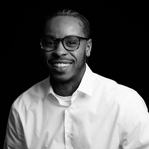 A headshot of Taylor Kirkland-Harvey