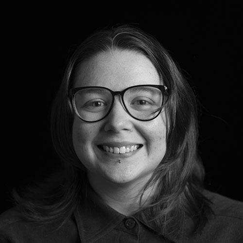 A black and white headshot of Cassandra Agostino