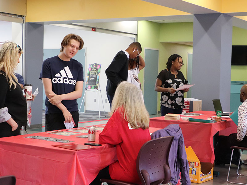 Prospective students and parents talk with CCAC staff and faculty