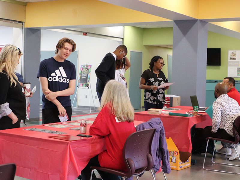 Potential students and families attend a CCAC open house event.